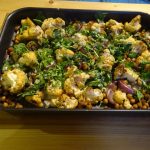 Cauliflower and spring green tray bake with tahini dressing
